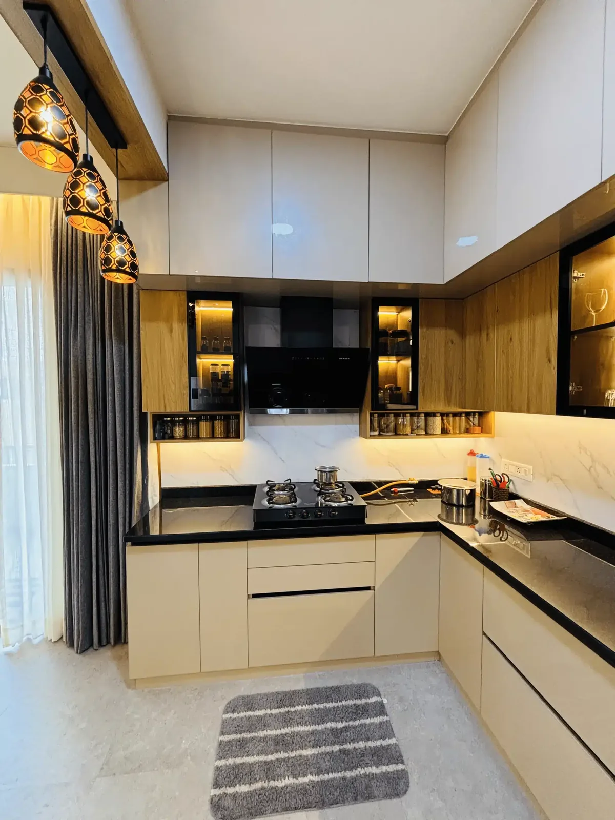 Kitchen counter and storage detail by Elegante Interiors