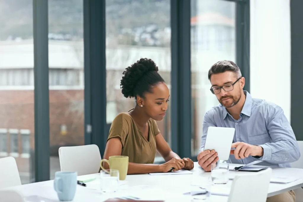 HVAC owner discussing agency contract terms during a business meeting