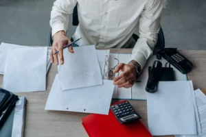 Business owner comparing proposals to decide how to choose an SEO company