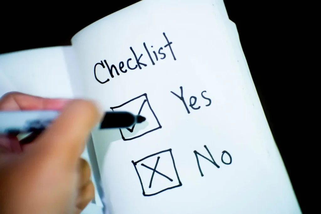 SaaS website audit checklist in a spreadsheet with pass/fail and priority columns